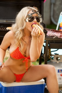 Jamie Bradford in orange mesh bikini for Playboy