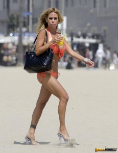 Shauna Sand in shiny orange bikini