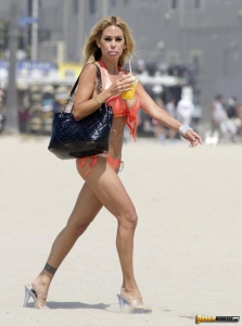 Shauna Sand in shiny orange bikini