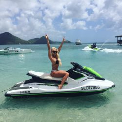 Cara Brett rides jet ski in bikini