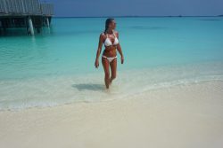 Billie Faiers on Kuramathi beach in wet white bikini
