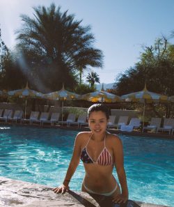 actress Cierra Ramirez comes out of pool in American flag bikini