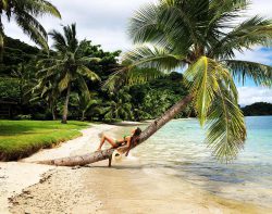 Maggie Q in bikini on tropical beach